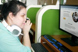 Girl reviewing MiAccess with a screen reader